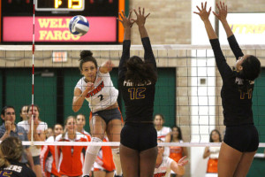 Senior right side hitter Alisha Watson spikes the ball against Prairie View A&M University in the UTRGV Fieldhouse in Edinburg.