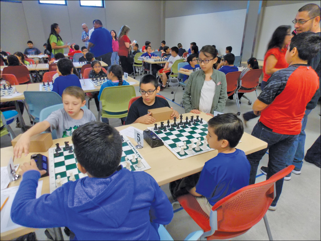 Students play against each other during the tournament that is set up for the last day of the chess summer camp so that students can know what a real chess tournament is like. COURTESY PHOTO