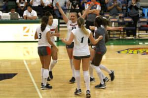 Sophomore Dubravka Vukoja celebrates a point with her teammates during a WAC match earlier this season. UTRGV will enter the WAC tournament this weekend in New Mexico, trying to build on the winningest season in program history. SARAH CARVAJAL/THE RIDER