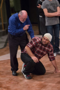 Assistant Professor Thomas Pearson rehearses as Creon, scolding the soldier, played by Isaac Gonzalez, in the tragedy “An gone.”