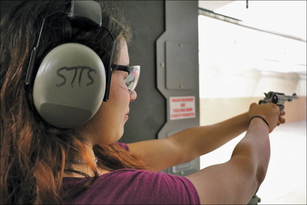 Lily Villarreal aims at a silhouette target with her .38-caliber revolver Wednesday night at the South Texas Tactical shooting range, located at 2100 Village Center Blvd. in Brownsville./Michelle Espinoza/The Rider