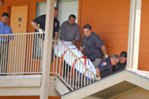 The body of a 20-year-old UTRGV student is removed from The Village apartments in Edinburg. LESLEY ROBLES/THE RIDER