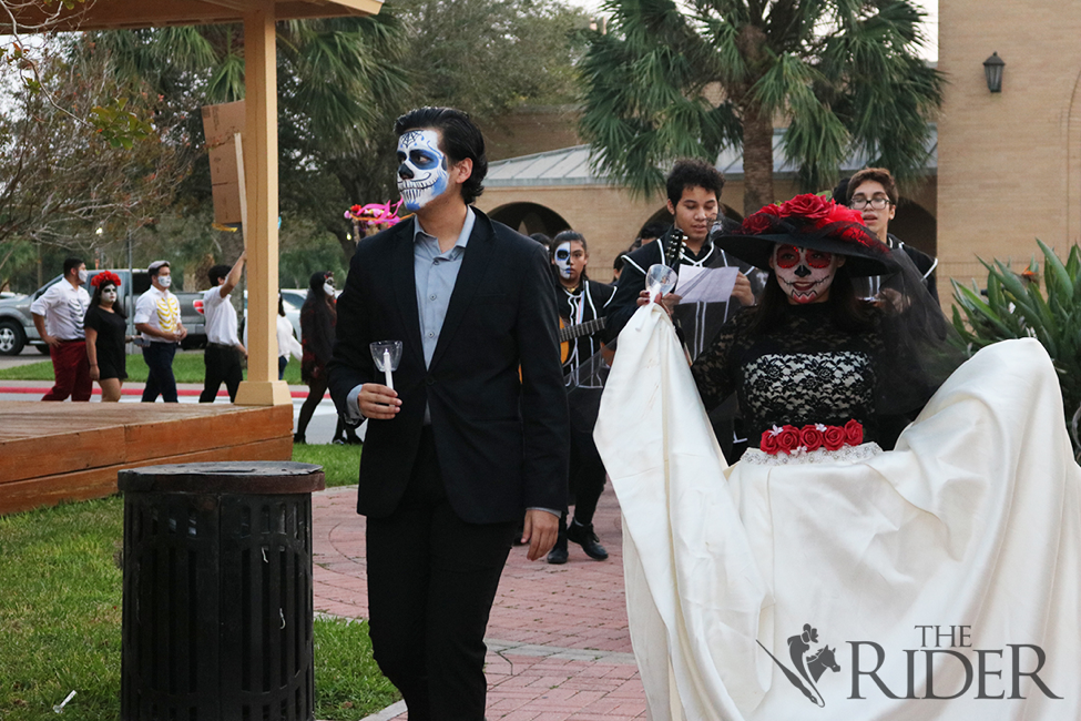 Texas Southmost College sophomore Eros Lujano and senior Vyktoria Olivares lead the Day of the Dead parade. 