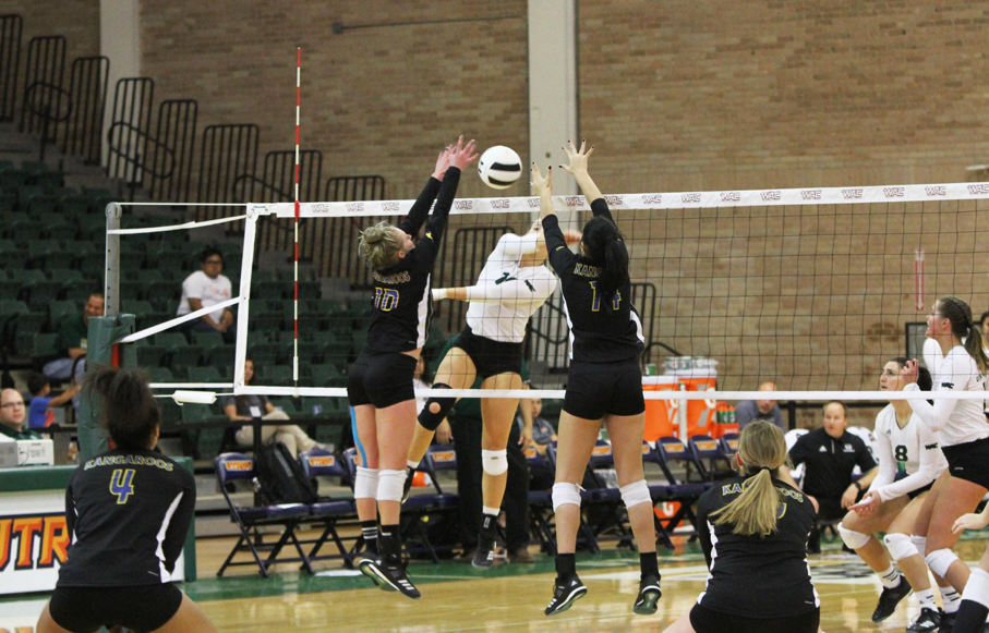 UVU’s Madison Dennison strikes a ball past two UMKC defenders during their 3-1 quarterfinals victory Thursday in the UTRGV Fieldhouse.