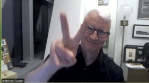 Anderson Cooper waving a peace sign