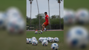 UTRGV Soccer player Issac Ochoa playing soccer.