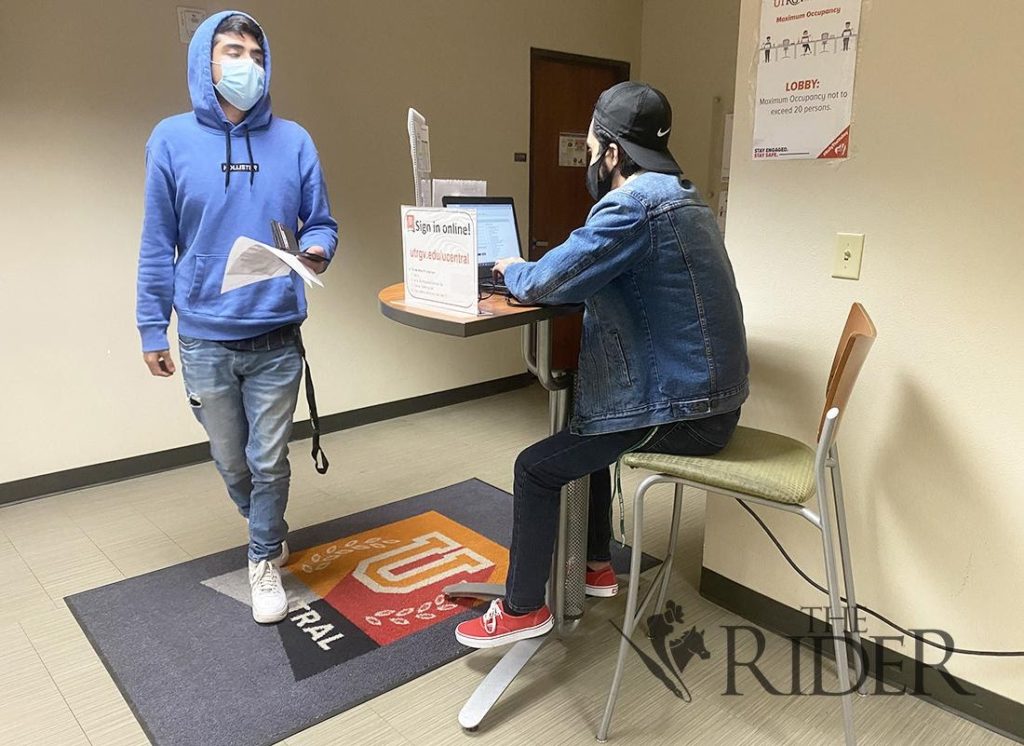 Freshman Hector Banda signs in last Tuesday at U Central. This semester, UTRGV is teaching 17.6% of classes in the traditional, in-person format, 15.5% hybrid, 34.6% asynchronous and 32.2% synchronous. Hybrid classes are taught both online and in person. Asynchronous classes are conducted completely online, and synchronous classes have scheduled meeting times online. Aaliyah Garza/The Rider