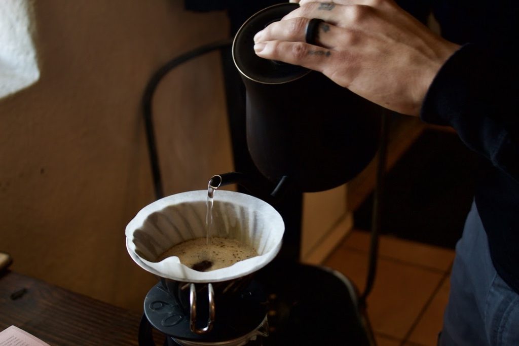 Grind Coffee Co. barista Michael Flores makes a pour-over at the shop on March 10.  Jacqueline Wallace/The Rider 