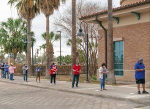 David Pike/ University Marketing and Communications People want in like to receive the COVID-19 vaccine last Friday outside the UTRGV Clinical Education Building in Harlingen.