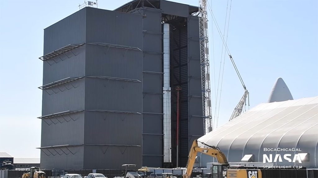 The Super Heavy Booster No. 1 (BN1) rocket undergoes stacking on March 18 at the SpaceX South Texas launch site at Boca Chica. The 165-foot-tall Starship vehicle and BN1 will be 394 feet tall. They will “represent a fully reusable transportation system designed to carry both crew and cargo to Earth orbit, the Moon, Mars and beyond,” as stated on the SpaceX website. SCREENSHOTS TAKEN BY ROXANNA MIRANDA FROM THE NASA SPACE FLIGHT WEBSITE