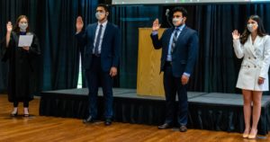 Student Government Association Chief Justice Samantha Lara (left) administers the oath of office to newly elected executives Brownsville Vice President Yahia Al-Qudah (second from left), President José Pablo Rojas and Edinburg Vice President Anacette Cantu. The inauguration ceremony was held Thursday in person on the Edinburg campus and via livestream, with senators taking the oath of office online. Steven Hughes/For The Rider