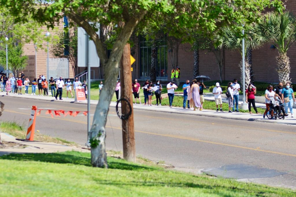 People wait in line last Thursday outside the UTRGV School of Medicine on the Edinburg campus to receive the COVID-19 vaccine. Jacqueline Wallace/The Rider Photo