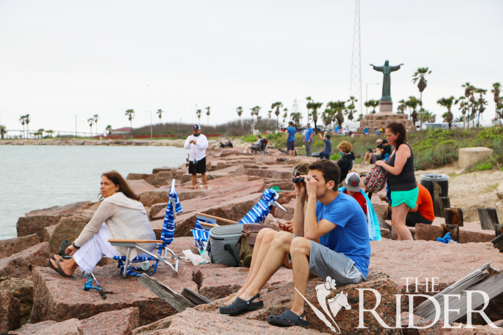 Spectators wait for the launch of SN15 on the Isla Blanca jetties at South Padre Island on April 30.  Alejandra Yañez/The Rider 