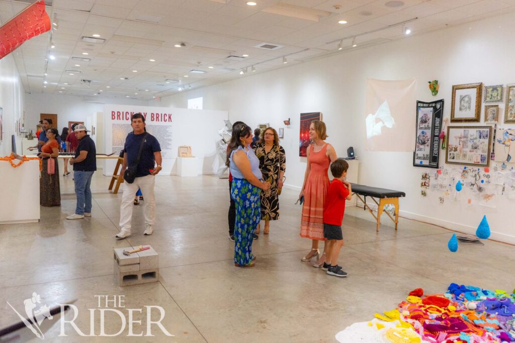 Attendees of the reception mingle and discuss the work from the exhibition, which features 19 artists from the Flower Shop Art Residency and the Flower Buds 956 Residency program.
Eduardo Escamilla/THE RIDER