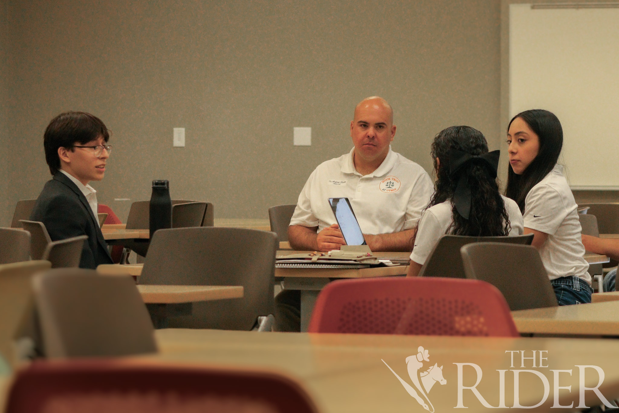 Laura Garcia, a marketing junior, challenges a statement by candidate and electrical engineering junior David Aguirre during the UTRGV Mock Trial Competition Team tryouts Wednesday in the Student Academic Center on the Edinburg campus. Abigail Ollave/THE RIDER