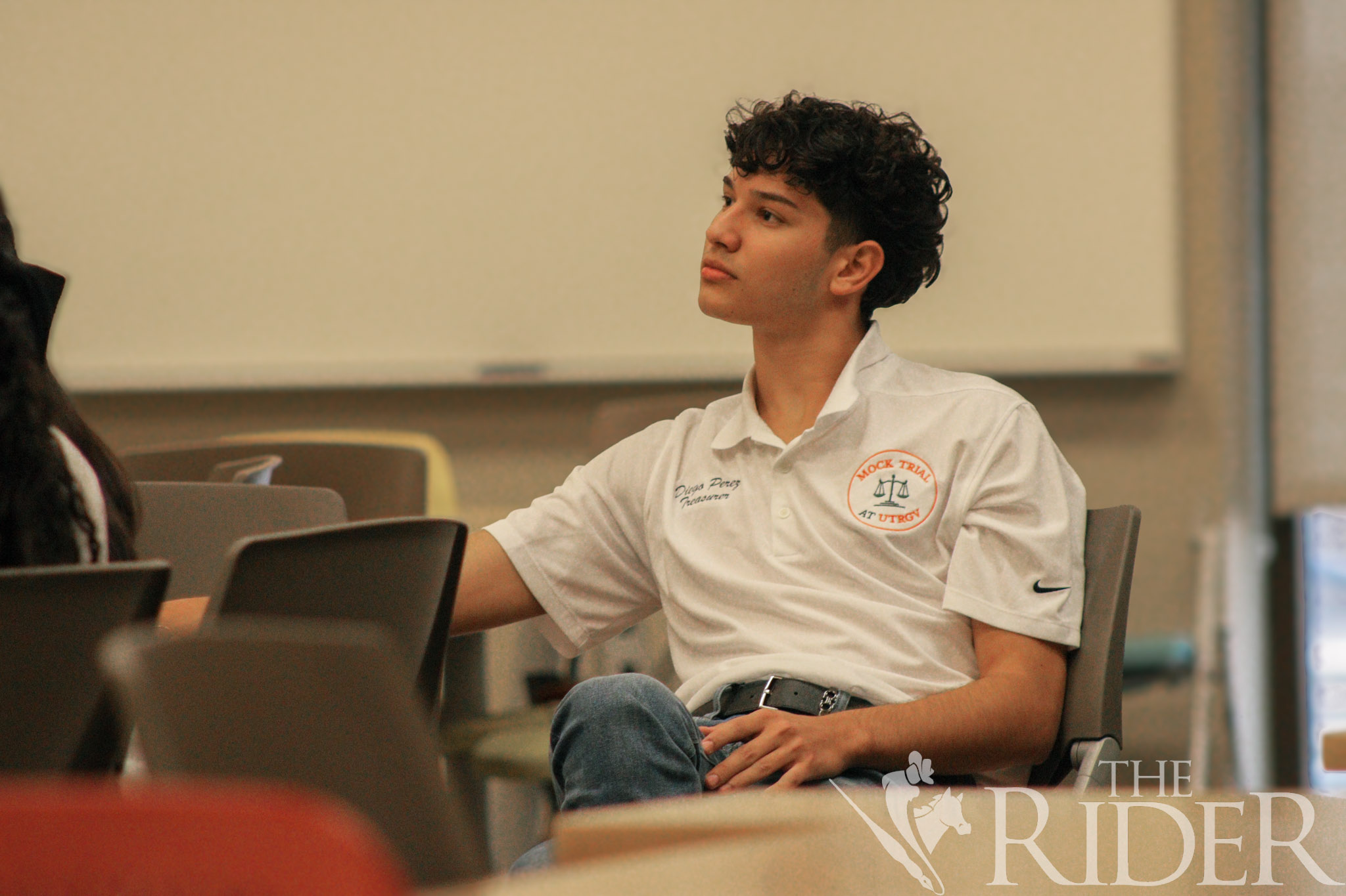 Diego Perez, an English junior and UTRGV Mock Trial Competition Team treasurer, listens to a candidate’s presentation Wednesday in the Student Academic Center on the Edinburg campus. Abigail Ollave/THE RIDER