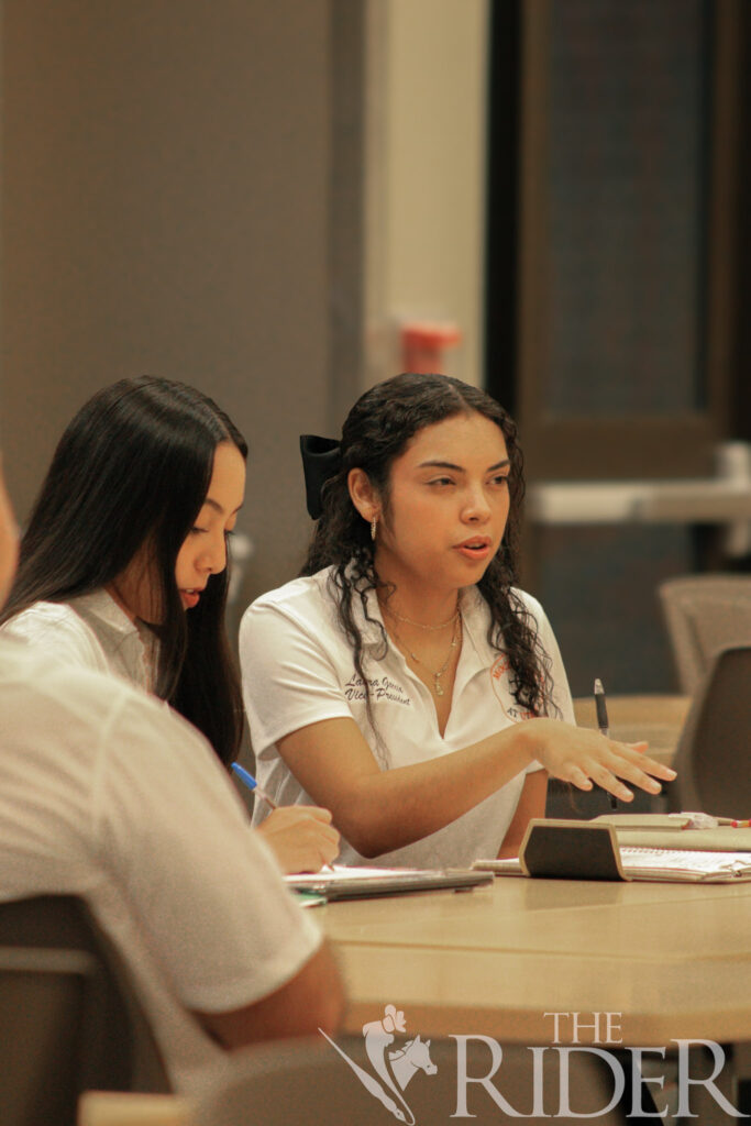 Laura Garcia, a marketing junior and the UTRGV Mock Trial Competition Team vice president, debates a candidate as part of the tryout process Wednesday in the Student Academic Center on the Edinburg campus. Abigail Ollave/THE RIDER