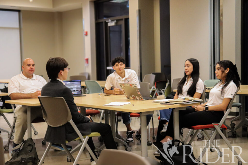 Members of the UTRGV Mock Trial Competition Team interview David Aguirre, an electrical engineering junior, at the tryouts Wednesday at the Student Academic Center on the Edinburg campus. Also shown are Andrew Smith (from left), an assistant professor of political science and faculty adviser; Diego Perez, treasurer; Izabella Gaytán, president; and Laura Garcia, vice president. Abigail Ollave/THE RIDER