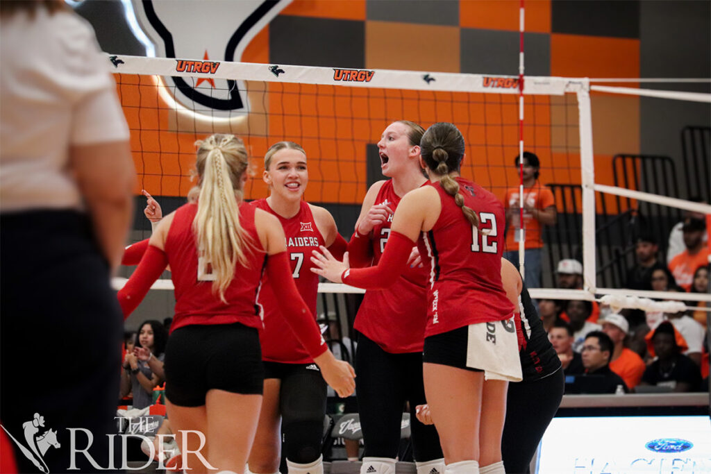 The Raiders celebrate another point during tonight’s sold-out match in the UTRGV Fieldhouse on the Edinburg campus. The Vaqueros lost 3-2. Abigail Ollave/THE RIDER