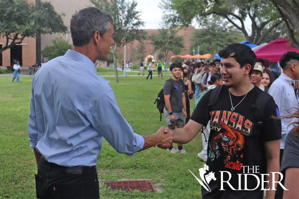 Former Democratic U.S. Rep. Beto O’Rourke greets biology sophomore Javier Gonzalez Thursday at the Chapel Lawn on the Edinburg campus. Angel Ballesteros/THE RIDER