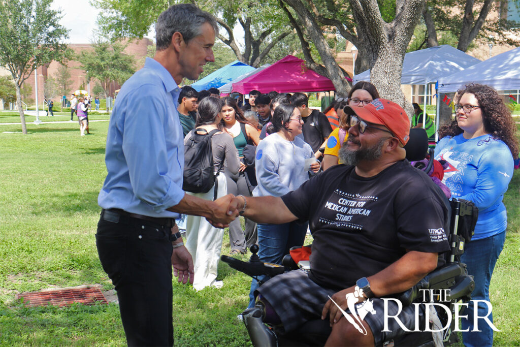 Former Democratic U.S. Rep. Beto O’Rourke greets disaster studies graduate student Rolando Serna Thursday at the Chapel Lawn on the Edinburg campus. Angel Ballesteros/THE RIDER