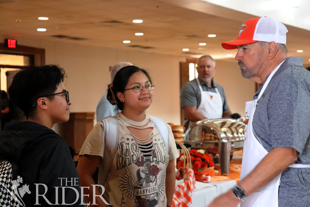 Integrated health science sophomore Skylar Amar (left) and biomedical science sophomore Fatima Anguiano speak with UTRGV President Guy Bailey Thursday during Picnic with the President in the PlainsCapital Bank El Gran Salón on the Brownsville campus. Venisha Colón/ THE RIDER