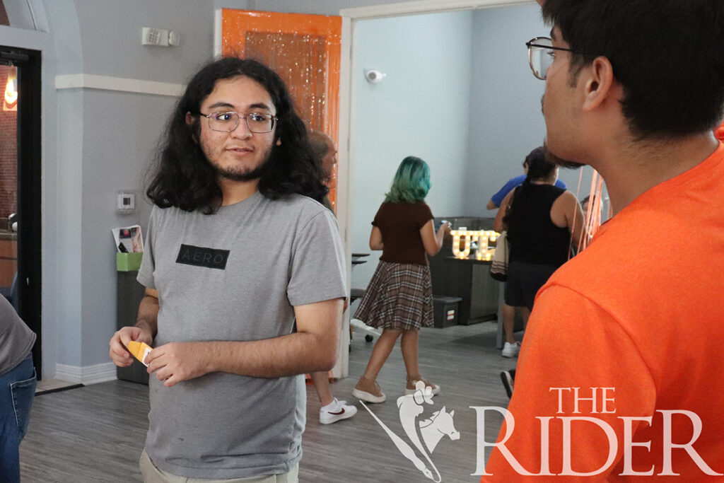 Lead Resident Assistant Rick Machuca (right) helps cyber security freshman Jose Ponce with Casa Bella onboarding Aug. 23 on the Brownsville campus. Silvana Villarreal/THE RIDER