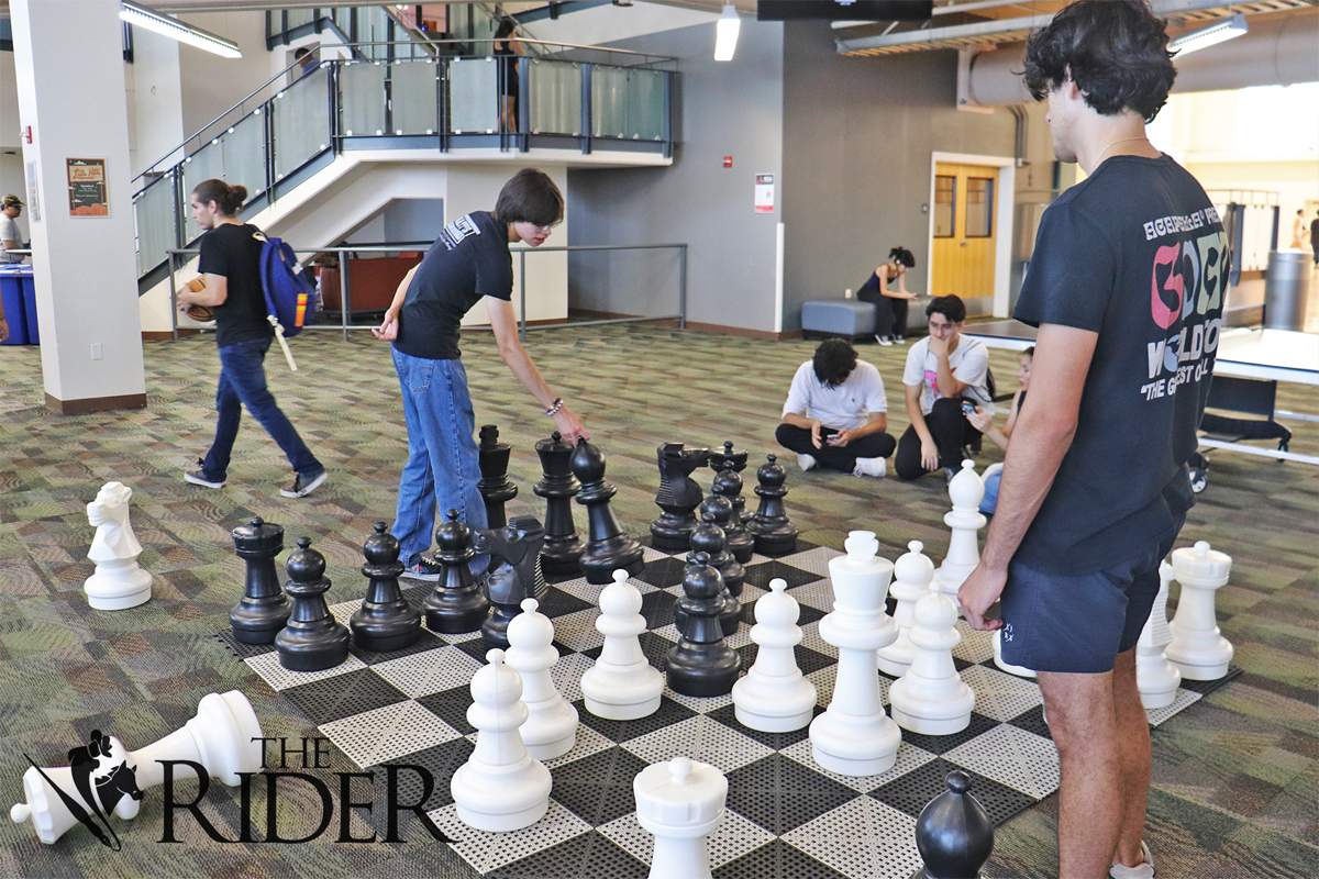 Biology freshman Benjamin Foreman (left) and finance freshman Jose Flores play giant chess Aug. 26 in the University Recreation center on the Edinburg campus. Angel Ballesteros/THE RIDER