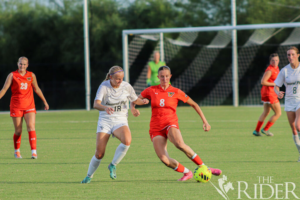 Vaqueros senior defender Abbie Bailey fights for possession of the ball against Yellow Jackets sophomore forward Madelynn Harry during a match Sept. 6 at the UTRGV Soccer and Track & Field Complex on the Edinburg campus. THE RIDER FILE PHOTO