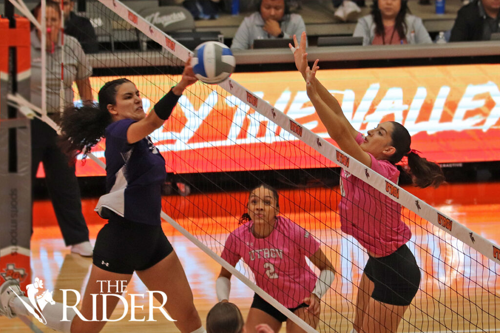 UTRGV middle blocker Margherita Giani attempts to block the ball before Stephen F. Austin State University middle blocker Izabella Ortiz can score during an October 2023 match in the Fieldhouse on the Edinburg campus. Also shown is UTRGV outside hitter Perris Key. THE RIDER FILE PHOTO