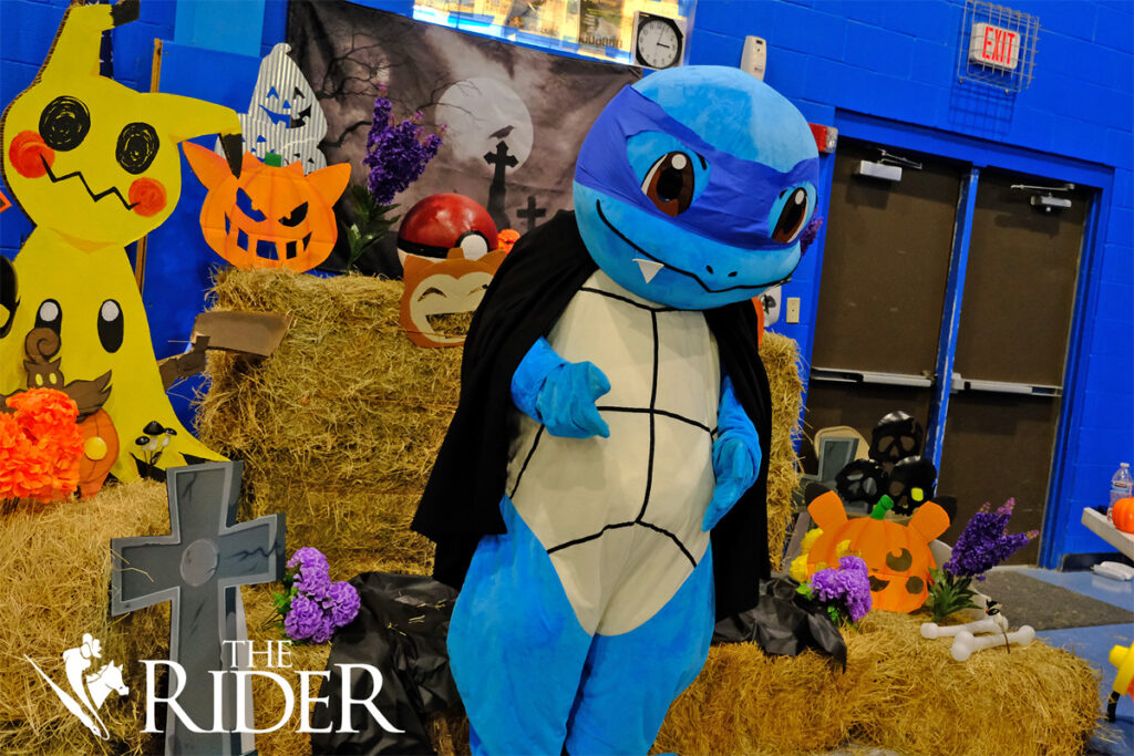 A Squirtle mascot stands in front of a photo backdrop during the RGV PokéFest Sept. 21 in the Mission Parks and Recreation building. Angel Ballesteros/THE RIDER