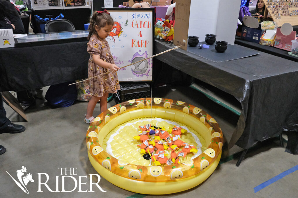 McAllen resident Opal Harris plays the “Catch A Karp” game during the RGV PokéFest Sept. 21 in the Mission Parks and Recreation building. Harris said her favorite Pokémon is Magikarp. Angel Ballesteros/THE RIDER