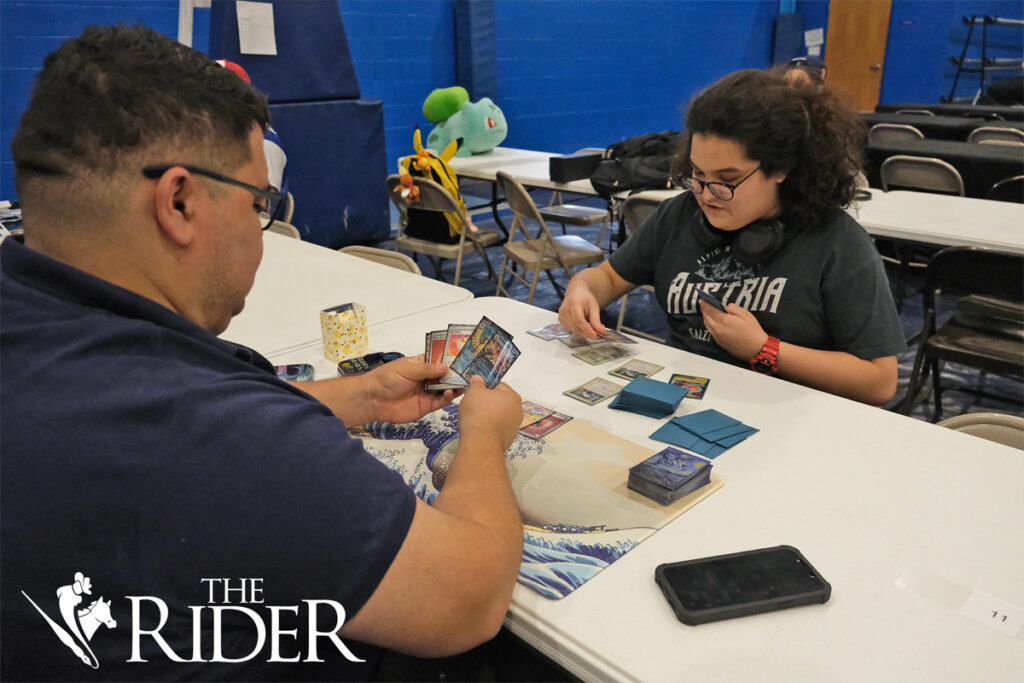 McAllen residents Manny Meza (left) and Alejandro Flores compete in a Pokémon card tournament during the RGV PokéFest Sept. 21 in the Mission Parks and Recreation building. Meza said his favorite Pokémon is Dragapault and Flores said his favorite is Dewott. Angel Ballesteros/THE RIDER