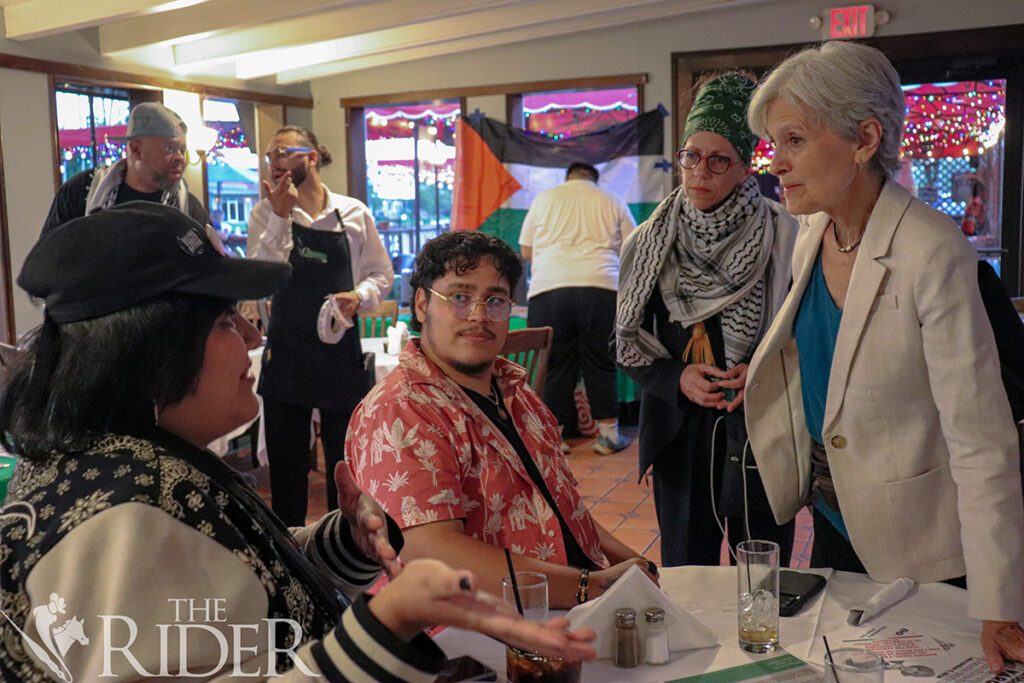 Dr. Jill Stein (right), the Green Party candidate for president, and Kelly Merrill, her deputy campaign manager, listen to local activist Citlaly Lopez (left) and Martin Cuevas during a meet and greet Tuesday at Cobbleheads in Brownsville. Venisha Colón/THE RIDER