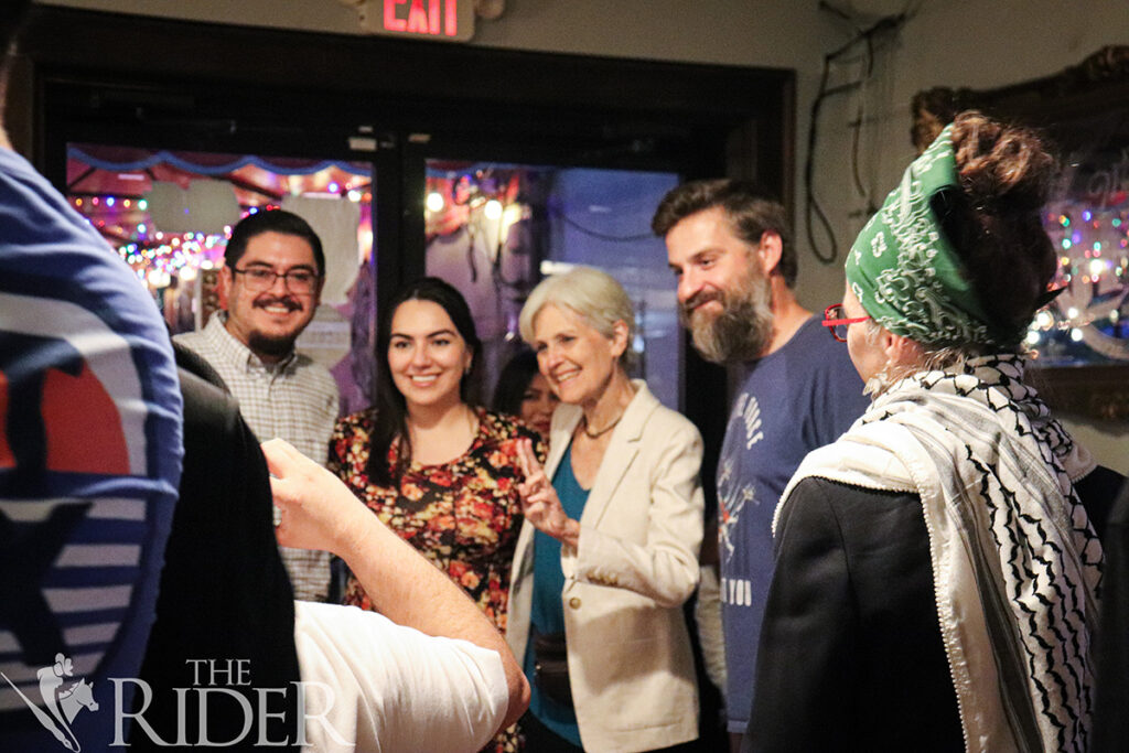 EJ Torres, Dani Sosa and Patrick Everitt pose for a photo with Dr. Jill Stein at Cobbleheads, on Tuesday in Brownsville. Venisha Colón/THE RIDER