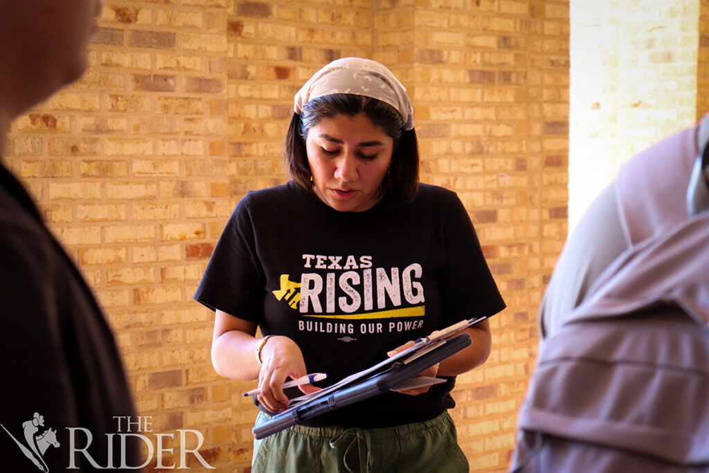 Public affairs graduate student Estrella Torres, the Texas Rising regional program coordinator, gathers voter registration applications Oct. 7 outside the University Library on the Brownsville campus. Venisha Colón/THE RIDER