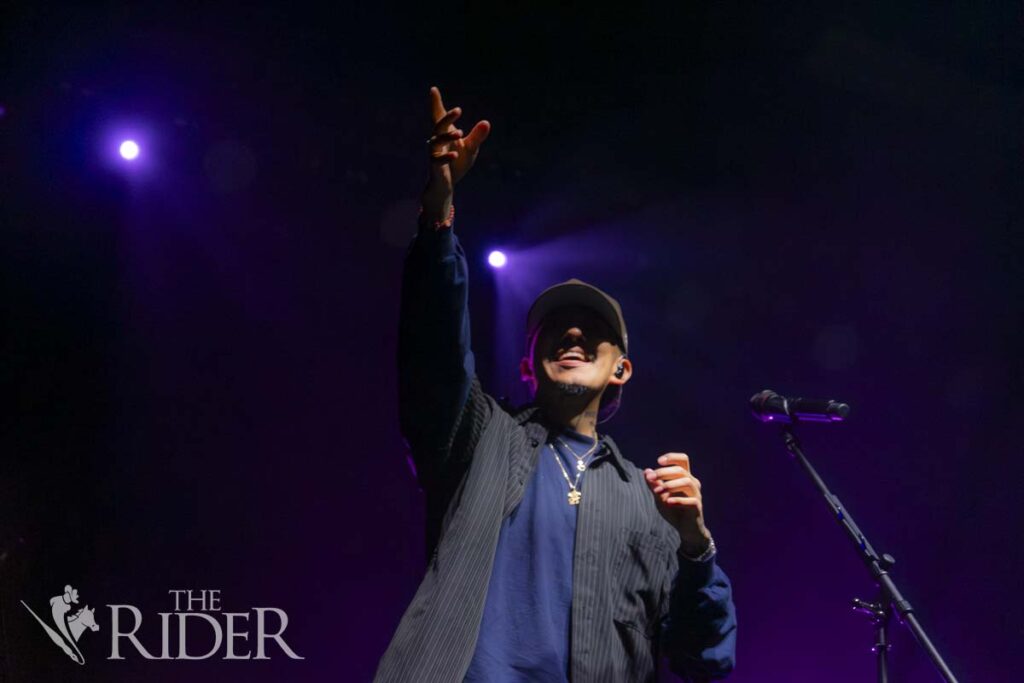 Omar Banos, known by his stage name Cuco, calls out for items that fans are holding up, such as albums, T-shirts and even shoes in between sets, to autograph them Sept. 30 at the McAllen Convention Center for his “4U” tour. Eduardo Escamilla/THE RIDER